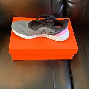 Grey/Pink and Black Nike Revolution tennis shoes
